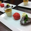 Dessert trio, hjortronpannacotta, hallon och yoghurt sorbet och en chokladgömma